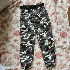 Black, white and grey camouflage cargo pants with built in belt clip